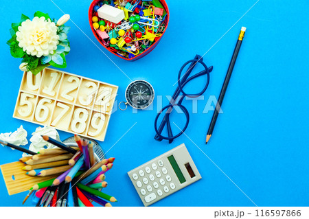 Back to school background with School supplies on blue paper background ready for your design and copy space for your text 116597866