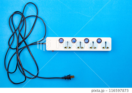 Electric power socket and plug on blue paper background 116597873