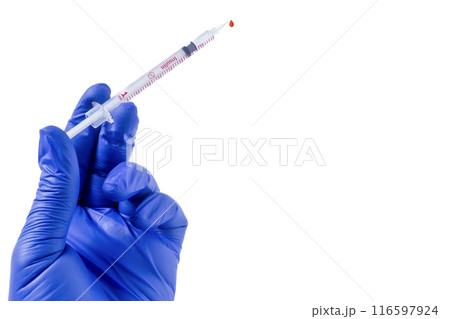 Blue gloved hand holding syringe isolated on white background 116597924