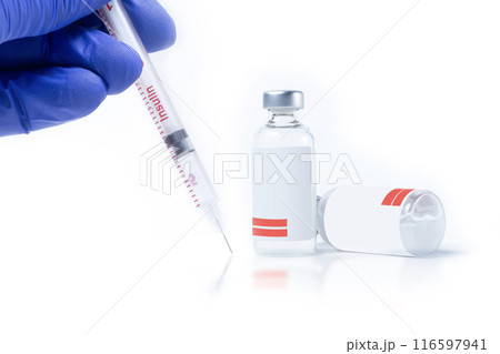 Doctor in blue gloves holding insulin syringe near two vials on white background. 116597941