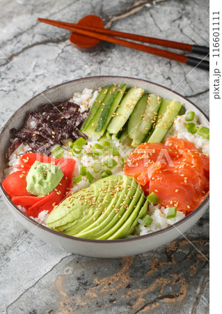 Sushi rice bowl recipe consists of sushi-grade seafood, the freshest toppings, and fluffy sushi rice to keep things healthy and satisfying closeup. Vertical Sushi rice bowl recipe consists of sushi-grade seafood, the freshest toppings, and fluffy sushi rice to keep things healthy and satisfying closeup. Vertical 116601111