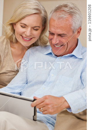 Happy Senior Man and Woman Couple Using Tablet Computer at Home Happy Senior Man and Woman Couple Using Tablet Computer at Home 116601208