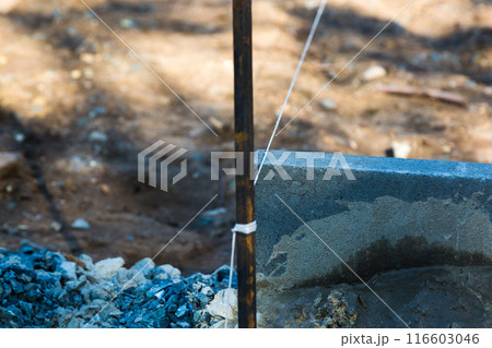 A roll of rope at a construction site for smooth laying of building material 116603046