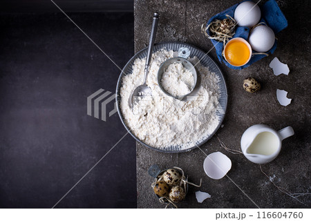Baking ingredients with flour and eggs Baking ingredients with flour and eggs 116604760