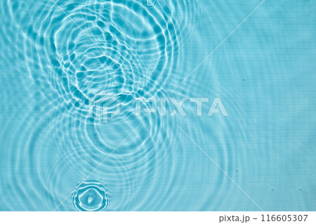 Calming ripples in a clear blue swimming pool 116605307
