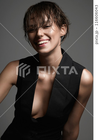 happy girl with wet short hair. young smiling woman in classic vest on naked body happy girl with wet short hair. young smiling woman in classic vest on naked body 116606043