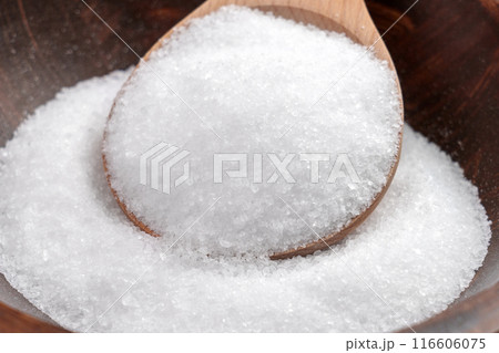 Epsom salt (Magnesium sulfate) crystals in wooden spoon close up. Relaxing spa ingredient Epsom salt (Magnesium sulfate) crystals in wooden spoon close up. Relaxing spa ingredient 116606075