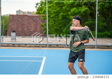 Professional male tennis player playing the tennis on outside court 116606115