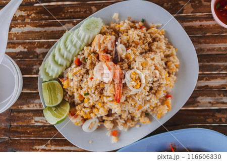 Thai Mixed Seafood shrimps and squids fried rice and lemon and cucumber. Thai Mixed Seafood shrimps and squids fried rice and lemon and cucumber. 116606830