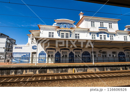 Historic building of old Aveiro Railway station ornamented with typical blue azulejos 116606926