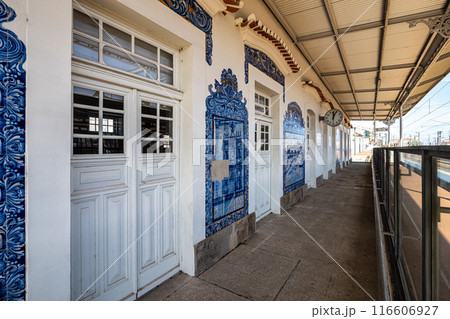 Historic building of old Aveiro Railway station ornamented with typical blue azulejos 116606927