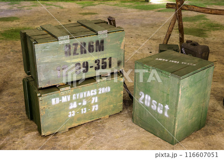 Wooden military crates for weapons and ammunition, Stacks of old military ammunition boxes. 116607051
