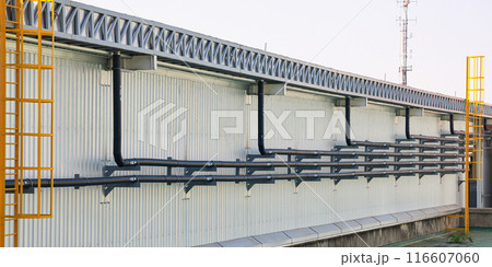 Orderly drainage pipes, pipe with label "RL" with direction for rain line to drain the water from building.  116607060