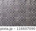 Handmade homespun fabric in an old rustic ethnic style. Traditional warm handmade texture effect. 116607090