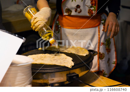 Freshly baked Turkish Gozleme, flatbread with greens and cheese. Freshly baked Turkish Gozleme, flatbread with greens and cheese. 116608740