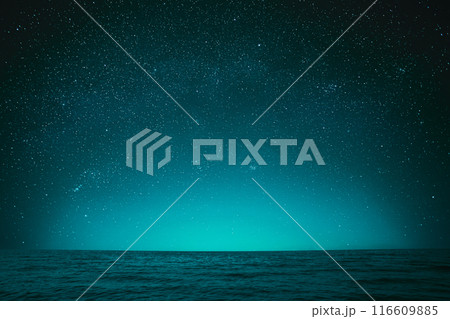 Night Sky Stars. Blue Night Starry Sky In Blue Color Above Ocean Sea Seascape Background Copy space Night Sky Stars. Blue Night Starry Sky In Blue Color Above Ocean Sea Seascape Background Copy space 116609885