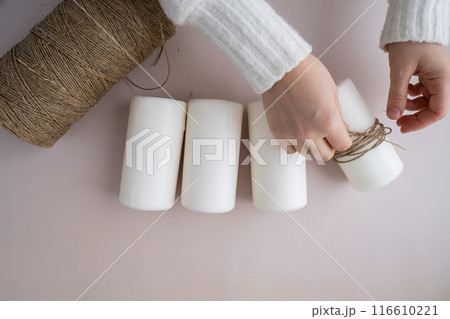 DIY process of woman making Christmas arrangement of advent candle calendar four weeks. Series of handmade craft instruction. Zero waste eco-friendly winter holiday decoration. New year 116610221