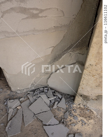 Concrete fragments and foam sheets from broken, damaged walls Concrete fragments and foam sheets from broken, damaged walls 116611102