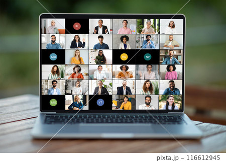 A laptop screen showing a group of individuals engaged in a virtual meeting or video conference. The people on the screen appear to be conversing or collaborating on a project remotely. A laptop screen showing a group of individuals engaged in a virtual meeting or video conference. The people on the screen appear to be conversing or collaborating on a project remotely. 116612945