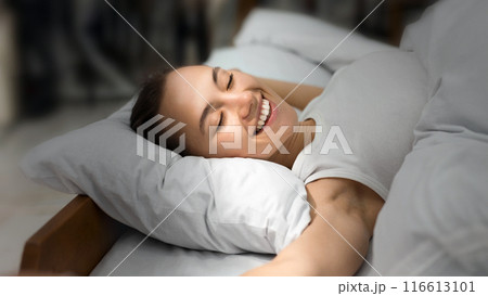 Happy Woman Waking Up And Stretching With Sunbeam On Face, Fully Rested Happy Woman Waking Up And Stretching With Sunbeam On Face, Fully Rested 116613101