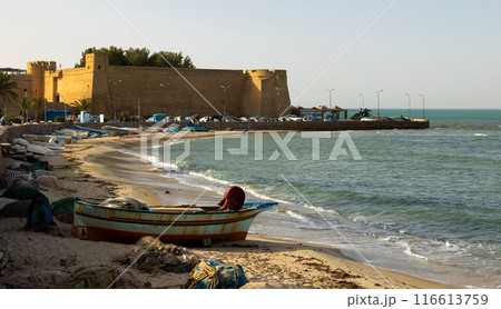 Mediterranean sea and outer stone wall of fort surrounding old medina of Hammamet, Tunisia Mediterranean sea and outer stone wall of fort surrounding old medina of Hammamet, Tunisia 116613759