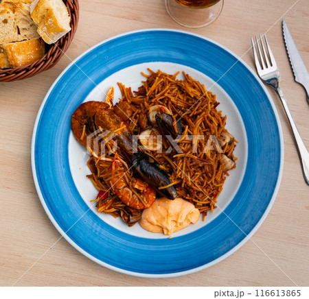Fideua with seafood served on platter 116613865