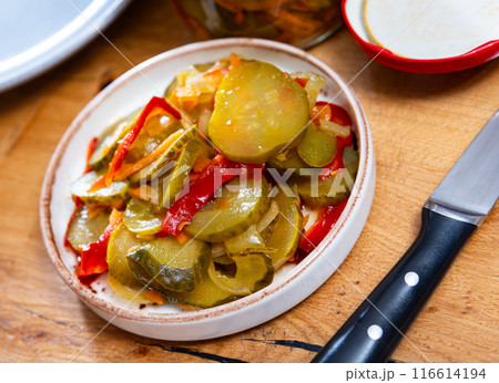 Crunchy pickled cucumber salad with red pepper and carrots 116614194