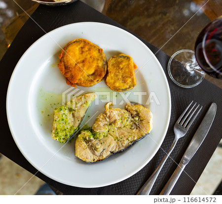 Fried swordfish fillet served with eggplant 116614572