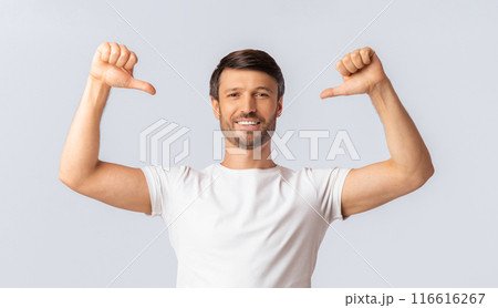 Self-Confidence Concept. Smiling Man Pointing With Thumbs At Himself Over White Studio Background. Isolated 116616267