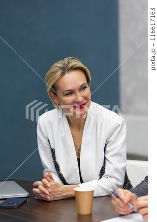 Female team leader at business meeting in office. 116617163