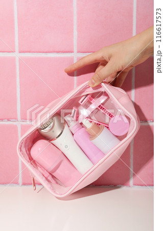 Accessories for depilation in pink cosmetic bags 116617573