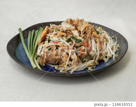 Fried Thai Noodles (Pad Thai) with Egg, Fried tofu, Dried shrimp, Bean sprouts, Chives and Roasted peanuts. Fried Thai Noodles (Pad Thai) with Egg, Fried tofu, Dried shrimp, Bean sprouts, Chives and Roasted peanuts. 116618352
