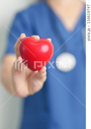 Doctor hand holding red heart shape in hospital. love, donor, world heart day, world health day, CSR donation and Insurance concepts 116619747