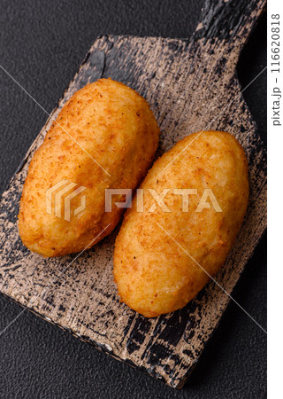 Delicious chicken Kiev or potato cutlets with salt, spices and herbs 116620818