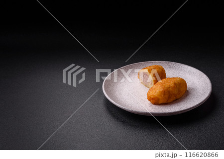 Delicious chicken Kiev or potato cutlets with salt, spices and herbs 116620866