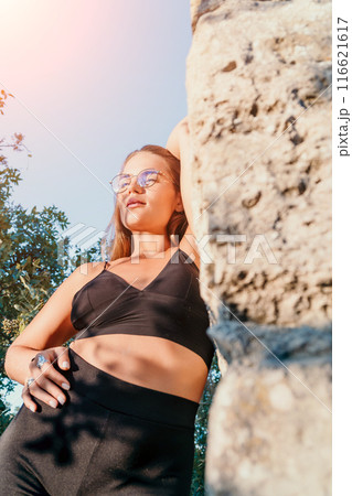 Woman summer travel. Happy tourist enjoy taking selfie photo outdoors for memories. Woman traveler posing in summer park on sunset, sharing travel adventure journey 116621617