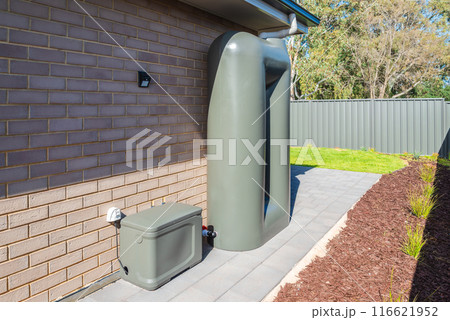 Rain water tank with pump box at suburban house in Australia 116621952