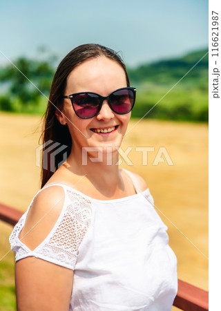 portrait of 36 years old russian woman in sunglasses on the summer day portrait of 36 years old russian woman in sunglasses on the summer day 116621987