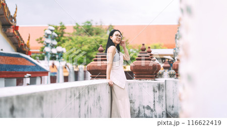 Asian woman standing at Wat Arun temple travel in Bangkok Thailand Southeast Asia Asian woman standing at Wat Arun temple travel in Bangkok Thailand Southeast Asia 116622419