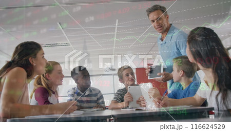 Image of trading board over male teacher showing digital pc to multiracial students in classroom 116624529