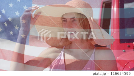 Image of flag of usa over caucasian woman by beach Image of flag of usa over caucasian woman by beach 116624599