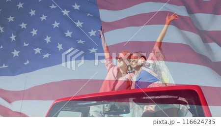 Image of flag of usa over happy diverse women in car by beach in summer Image of flag of usa over happy diverse women in car by beach in summer 116624735