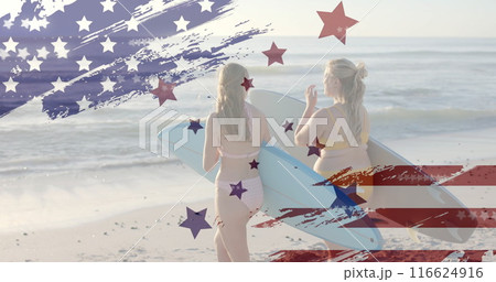 Image of flag of usa over happy caucasian women with surfboards on beach in summer Image of flag of usa over happy caucasian women with surfboards on beach in summer 116624916