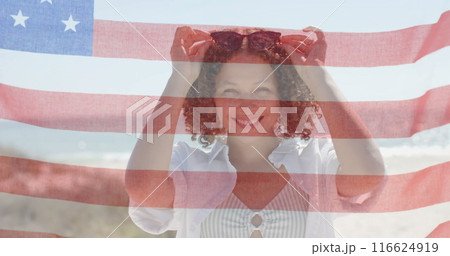 Image of flag of usa over happy diverse friends on beach in summer 116624919
