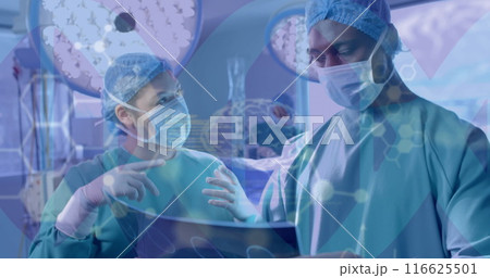 Image of scientific data processing over diverse surgeons in hospital 116625501