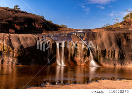 Tham Phra Waterfall Waterfall located in Bueng Kan Province, Thailand. There will be little water in the summer 116628276