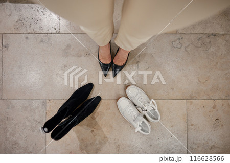 Shoes fitting concept, shot with view from above on female feet Shoes fitting concept, shot with view from above on female feet 116628566