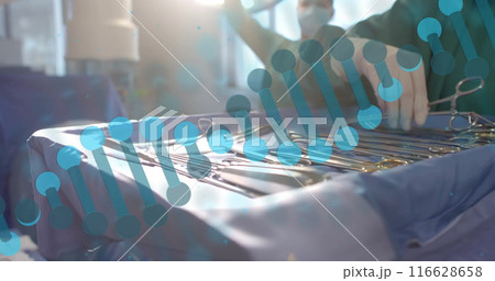 Arranging surgical instruments, medical professional preparing for operation in hospital Arranging surgical instruments, medical professional preparing for operation in hospital 116628658