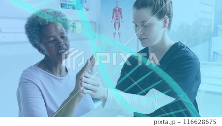 Medical professional assisting elderly patient with hand exercises in clinic Medical professional assisting elderly patient with hand exercises in clinic 116628675