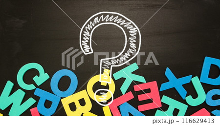 Image of question mark with letters over black background 116629413